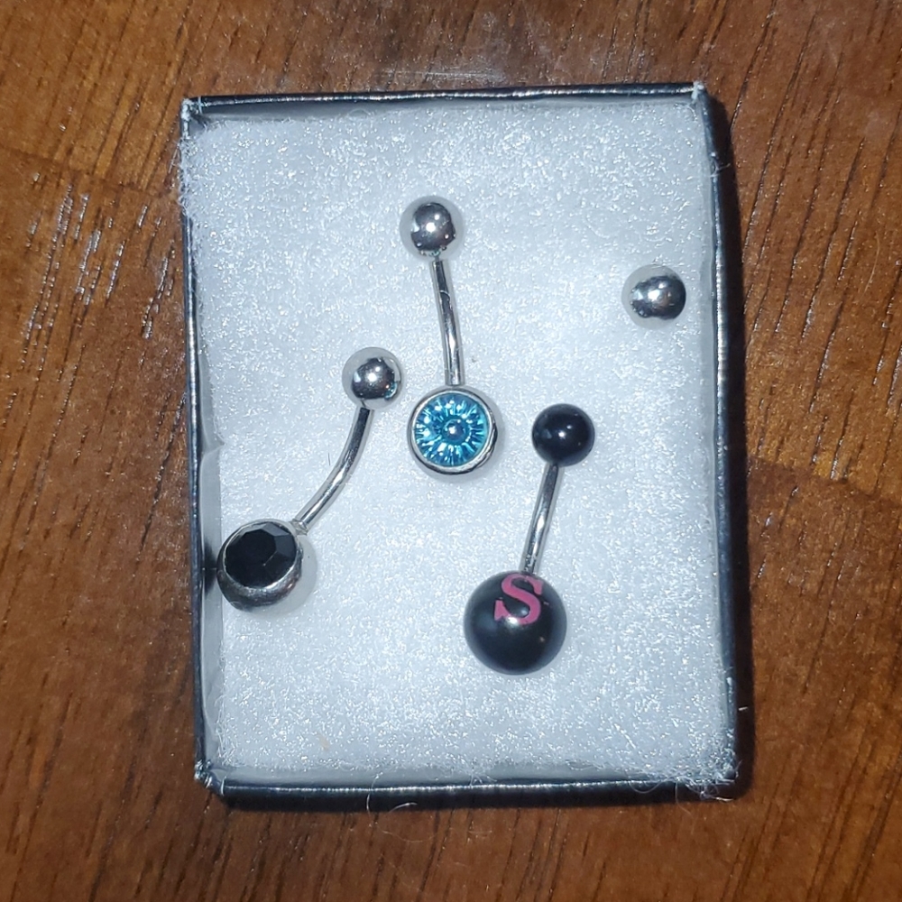 3 belly button rings silver stainless. Extra ball.
